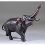 Seiya Genryusai (19th/20th Century) - Bronze model of a charging bull elephant, its trunk raised,