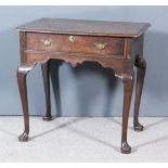 A Mid 18th Century Oak Lowboy, the two plank top with moulded edge and rounded front corners, fitted