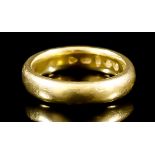 A 22ct Gold Wedding Band, Early 20th Century, size N, gross weight 8.9g