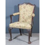 A George II Walnut Framed Open Armchair in the French Manner, the shaped and moulded showwood