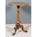 A Victorian Walnut and Inlaid Circular Tripod Table, the top inlaid with central floral paterae