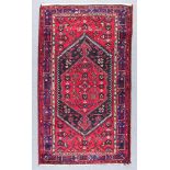 Two Hamadan Rugs, Modern, each woven in colours with a bold central medallion on a black ground, the