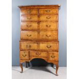 An 18th Century Figured Walnut and Grained Wood Sided Chest on Stand, the drawer fronts with matched