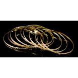 Eight 14ct Gold Stiff Bangles, gross weight 37g