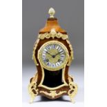 An Early 20th Century French Walnut and Gilt Brass Mounted Mantel Clock of "Louis XV" Design, the