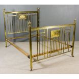 A Late Victorian/Early 20th Century Brass 5ft Bedstead, the square uprights with reeded urn finials,