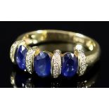 A Three Stone Sapphire Ring, Modern, in 18ct gold mount, the three sapphires, approximate total