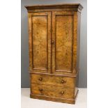 A Victorian Figured Walnut Wardrobe, the interior fitted hanging compartment, two shelves and two