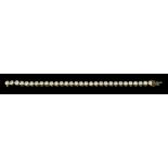 An 18ct Gold Diamond Line Bracelet, 20th Century, collet set with thirty round brilliant cut