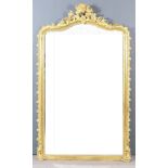 A Late 19th Century French Gilt Framed Rectangular Overmantel Mirror, the shaped and moulded top