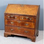 A Mid 18th Century Walnut Bureau, the top and slope veneered in burr walnut, the drawer fronts in