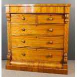 A Victorian "Scottish" Satin Walnut Chest, the upper part with serpentine front and square top edge,