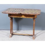 A 19th Century Walnut and Stained Pine Games Table, the burr walnut veneered fold-over top with