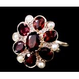 A Seed Pearl and Red Stone Flower Head Pattern Ring, Modern, in 9ct gold mount, set with five