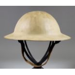 A World War I American Steel Helmet, the under rim indistinctly stamped "FS76"
