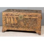 A Chinese Carved Hardwood Rectangular Blanket Chest, the whole carved with junks in bay surrounded