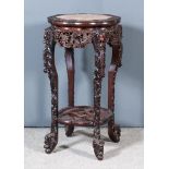 A Late 19th Century Chinese Rosewood Circular Two-Tier Jardiniere Stand, of shaped outline, the