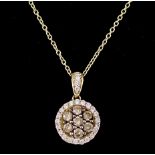 A Diamond Flowerhead Pendant, Modern, 10mm diameter, in 14ct gold mount, the centre set with seven