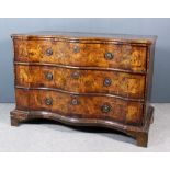 An 18th Century South German Figured Walnut Serpentine Fronted Commode, the figured quarter veneered