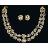 A Diamond and Enamel Necklace and a Pair of Matching Earrings, the two-strand necklace of