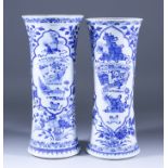 Two Chinese Blue and White Porcelain Sleeve Vases, painted with objects within shaped reserve