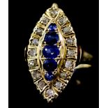 A Sapphire and Diamond Ring, 20th Century, in 18ct gold mount, the oval face set with five