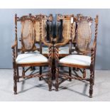 Two Pairs of 1920's Oak High Back Armchairs of "Carolean" Design, with shaped and moulded crest
