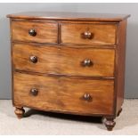 A Victorian Mahogany Bowfront Chest, fitted two short and two long drawers, on turned feet, 38ins