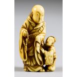 A Japanese Carved Ivory Netsuke of a Priest and Child (Karako) by Tomoshika, 18th Century (Edo