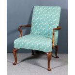 A Walnut Square Back Open Arm Library Armchair, the seat and back upholstered in green trellis