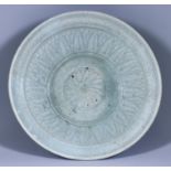 A Thai Celadon Bowl, incised with flower and leaf design, 10.75ins (27.3cm) diameter x 3.125ins (7.