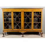 A 1920's Mahogany Dwarf Bookcase of "Chippendale" Design, with oval bead carved edge to top,