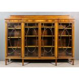 An Early 20th Century Mahogany Breakfront Dwarf Bookcase, the whole inlaid with stringings, with