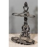 A Victorian Black Painted Cast Iron Umbrella Stand, of leaf scroll form, 15ins wide x 26ins high