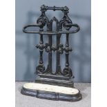 A Victorian Cast Iron Umbrella Stand, with fretted back, on oval moulded base, 20ins wide x 28.