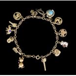 A 14ct Gold Link Charm Bracelet, hung with fourteen charms, 190mm, total gross weight 12g