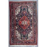 A Hamadan Rug, Modern, woven in colours, with a pole medallion and conforming spandrels, the field