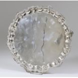 A 20th Century Egyptian Silvery Metal Circular Tray, the moulded piecrust rim with cast shell and