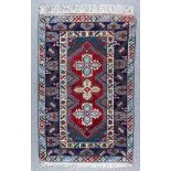 A Turkish Rug of Kazak Design, Modern, woven in colours with a central pole medallion filled with