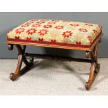 A Victorian Mahogany Rectangular Stool, the seat upholstered in needlework, on X-pattern end