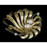A Diamond Ribbon Pattern Brooch, Modern, in 14ct gold mount, set with two central brilliant cut