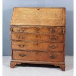 A George III Oak Bureau, the top, slope and drawer fronts crossbanded in mahogany, the slope