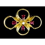 A Ruby and Diamond Ribbon Pattern Brooch, Modern, in 18ct gold mount, the centre set with one