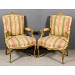 A Pair of French Gilt Framed Open Arm Fauteuils of "Louis XV" Design, the shaped and moulded backs