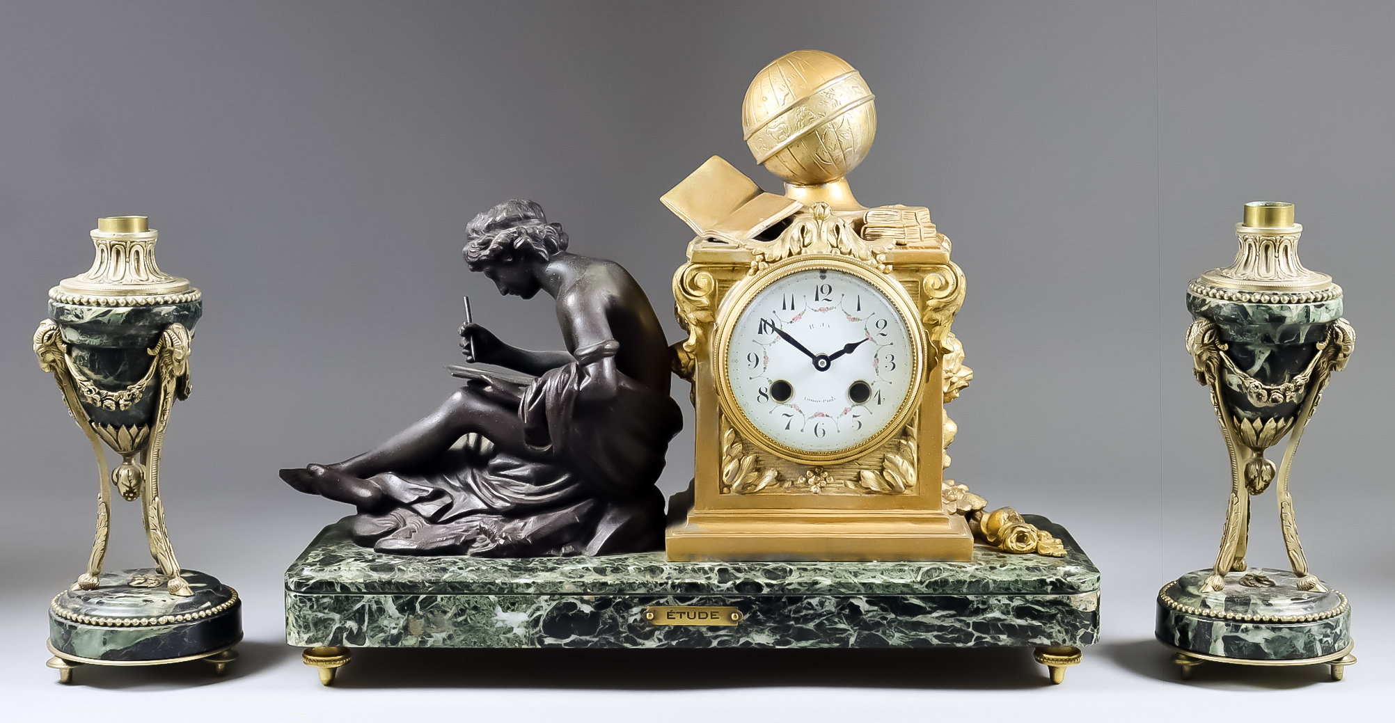 A 19th Century French Gilt Metal and Green Veined Marble Three-Piece Clock Garniture, the clock with