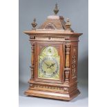 A Late 19th Century German Oak Cased Mantel Clock, by Winterhalder & Hofmeier, the brass dial with