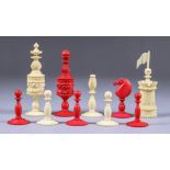 A Bone Natural and Red Stained Chess Set, 19th Century, kings 4.25ins (10.8cm) high, pawns 1.
