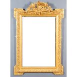 A French Gilt Framed and Moulded Rectangular Wall Mirror, with ornate moulded scroll cresting and