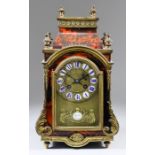A 19th Century French Red Tortoiseshell, Boulle and Gilt Brass Mounted Mantel Clock of "Louis XIV"