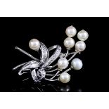 A Pearl Spray Brooch, 20th Century, in 14ct white gold mount, set with eight cultured pearls, each
